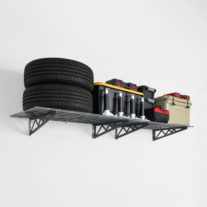 Wall-mounted metal shelves with storage bins and tires in a garage.