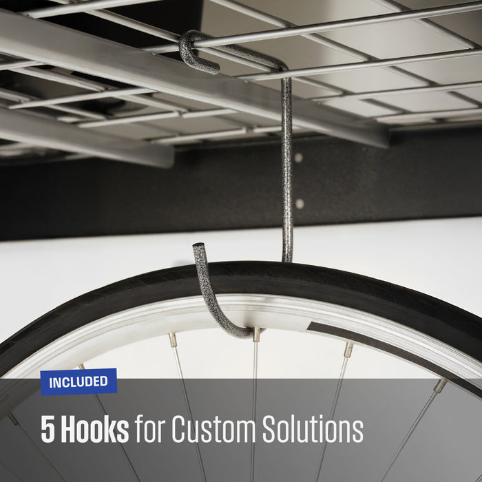 Close-up of a textured grey metal hook hanging from a garage shelf, with a bicycle tire partially visible to demonstrate use. Text overlay reads 'INCLUDED 5 Hooks for Custom Solutions'.
