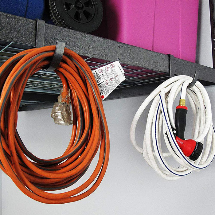 gray rail hooks on the side of garage storage rack holding electric cord and hose