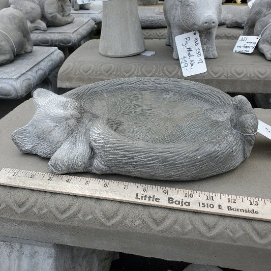 Concrete cat-shaped birdbath with sleeping cat design